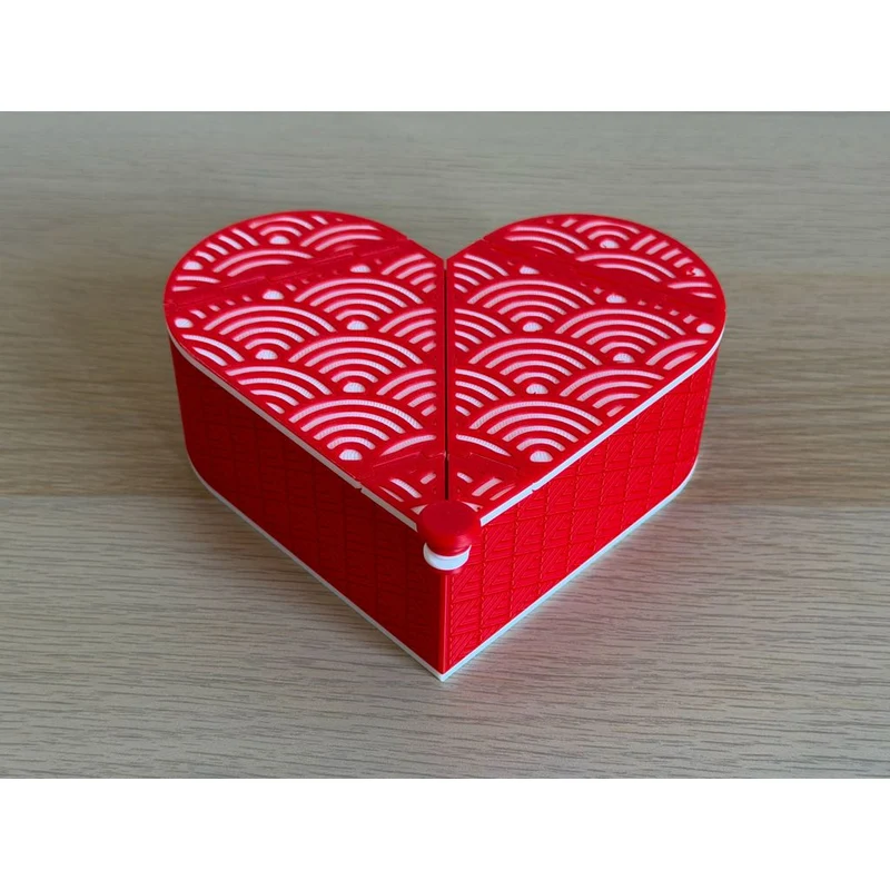 Boîte en forme de cœur avec couvercle origami pliable