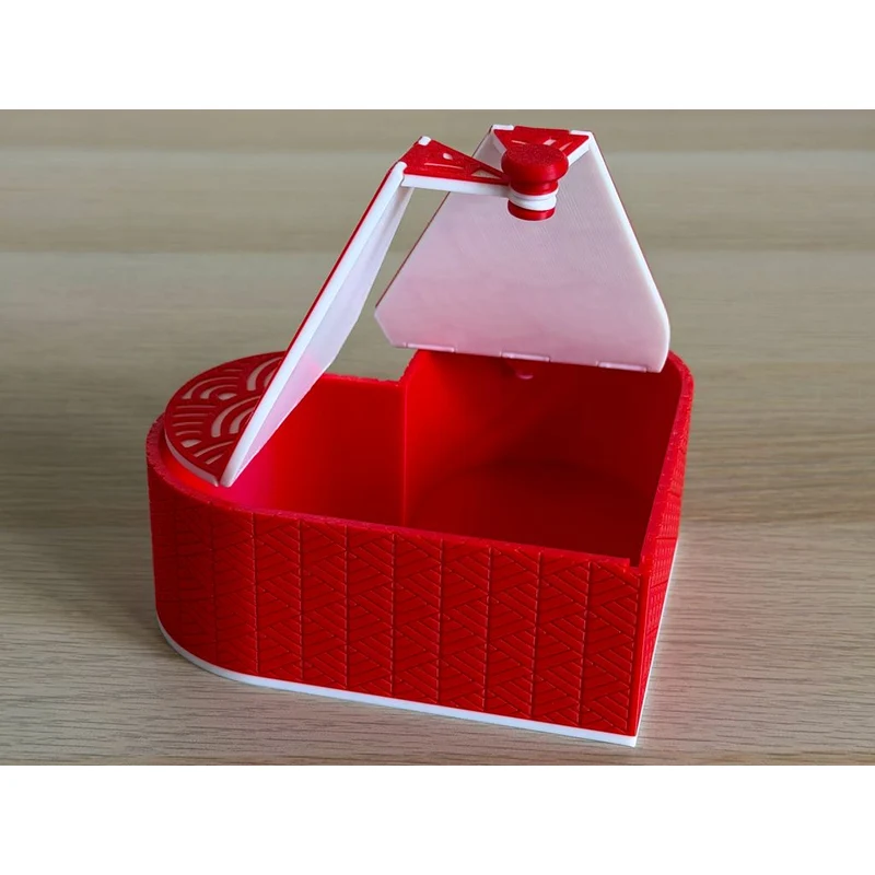 Boîte en forme de cœur avec couvercle origami pliable