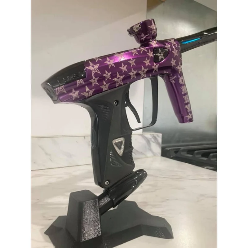 Support stable pour le rangement du marqueur de paintball