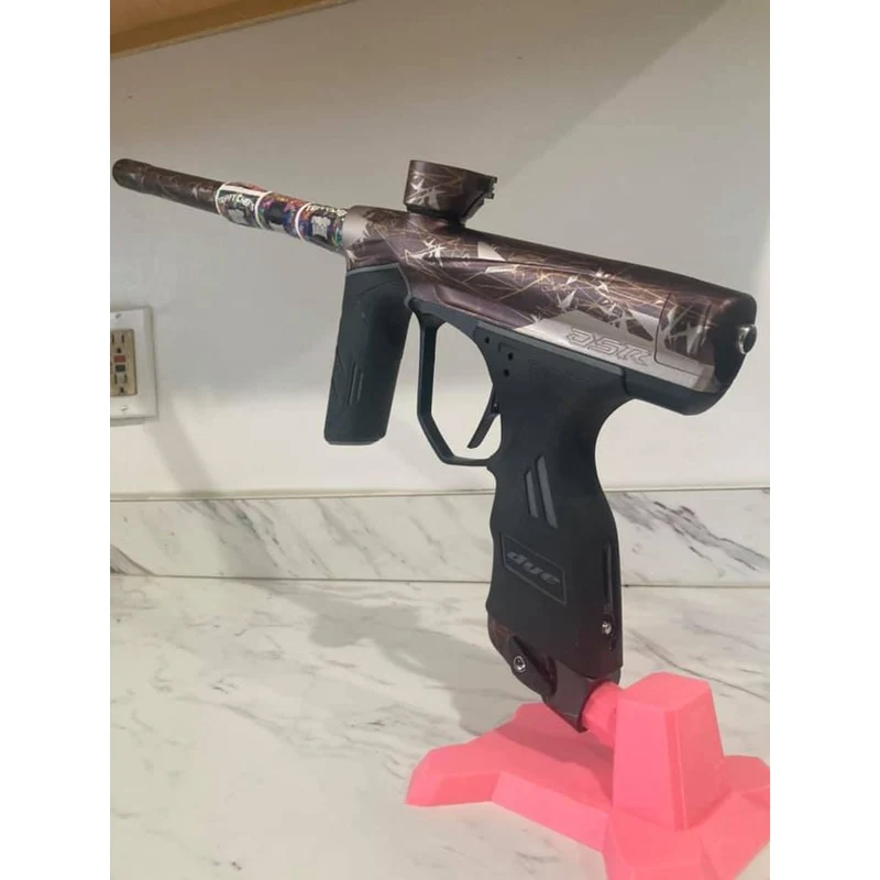 Support stable pour le rangement du marqueur de paintball