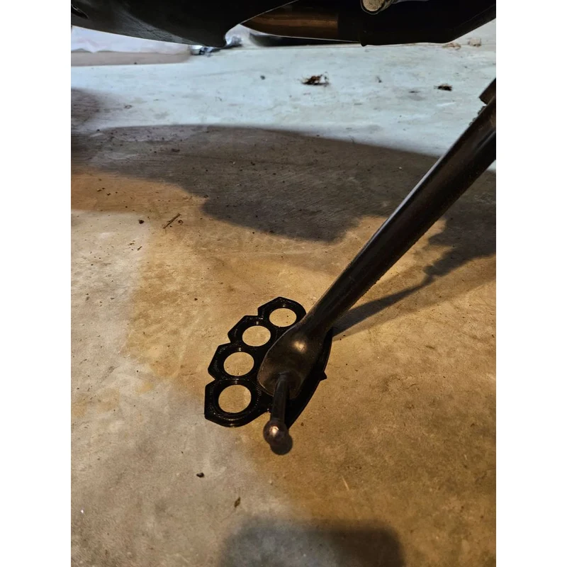 Plaque de béquille avec design en fer forgé pour moto