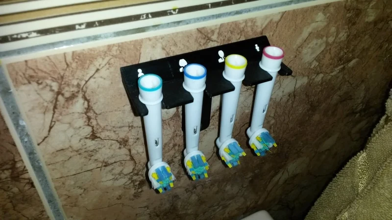 Support mural Braun pour têtes de brosse à dents - avec icônes familiales