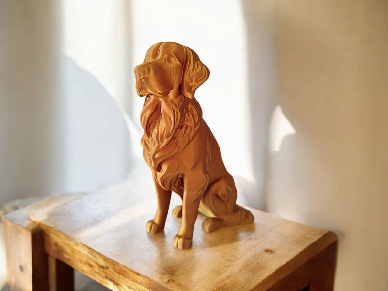 Élégante sculpture de Golden Retriever aspect bronze
