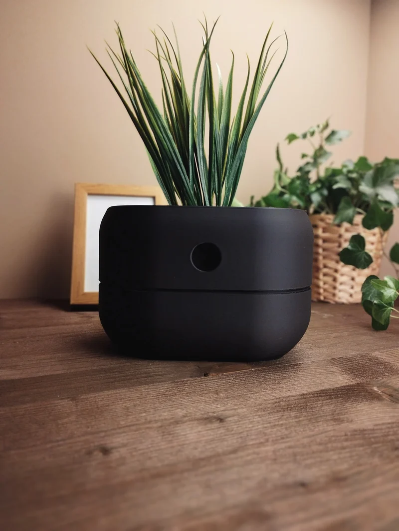 Pot de fleurs auto-arrosant minimaliste avec réservoir d'eau intégré