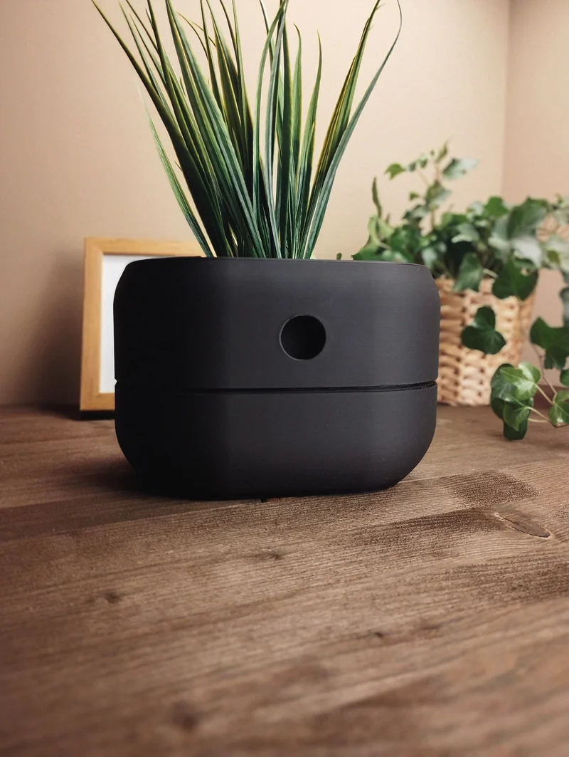 Pot de fleurs auto-arrosant minimaliste avec réservoir d'eau intégré