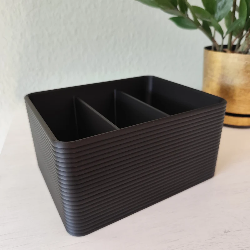 Support de télécommande au design côtelé pour table basse
