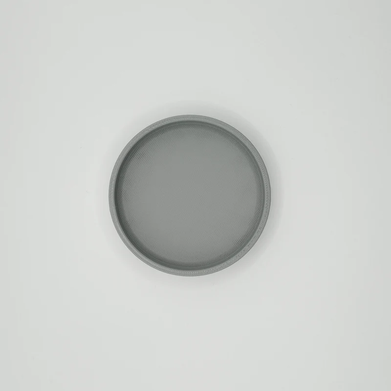 Plateau à clés rond minimaliste pour un rangement pratique