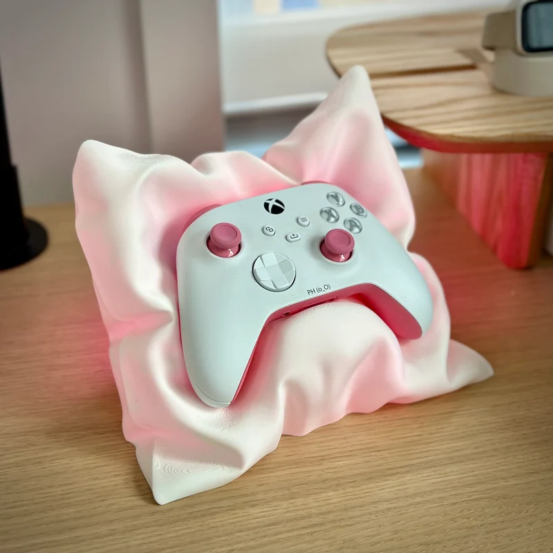 Support en forme de coussin pour manettes Xbox et Switch