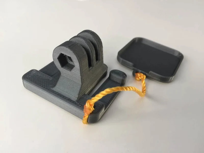 Fixation de sac à dos GoPro Session sur bandoulière avec couvercle d'objectif