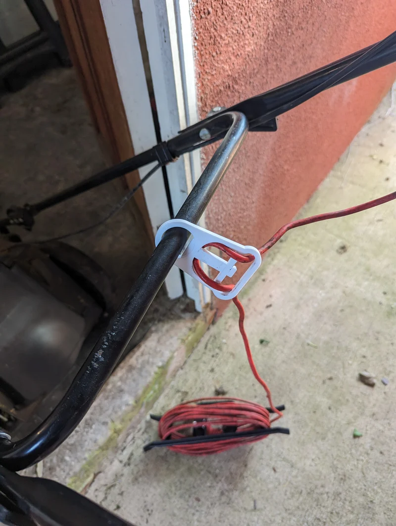 Support de câble pour tondeuse à gazon électrique