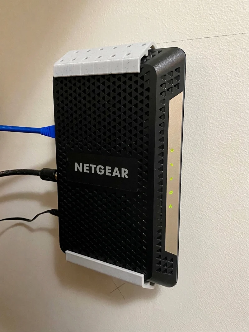 Montage mural Netgear CM600 / CM1000 – Optimisez la configuration de votre réseau