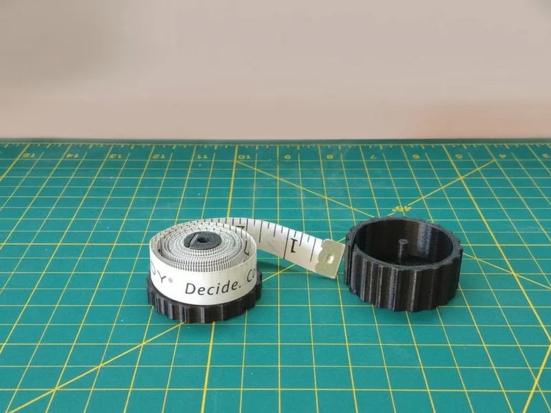 Support pour mètre ruban textile