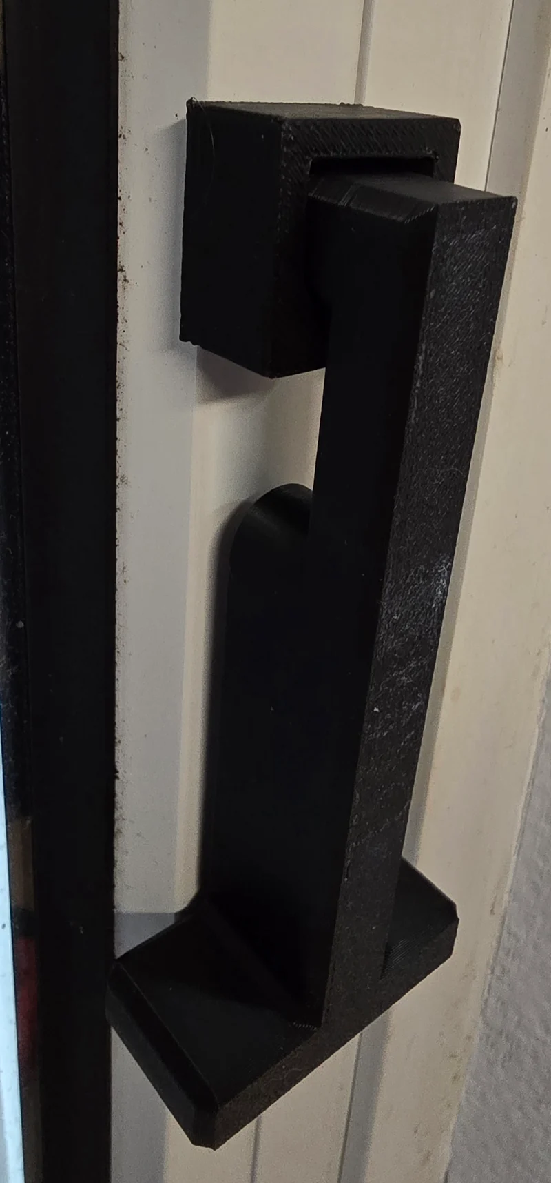 Butée oscillante pour fenêtres et portes