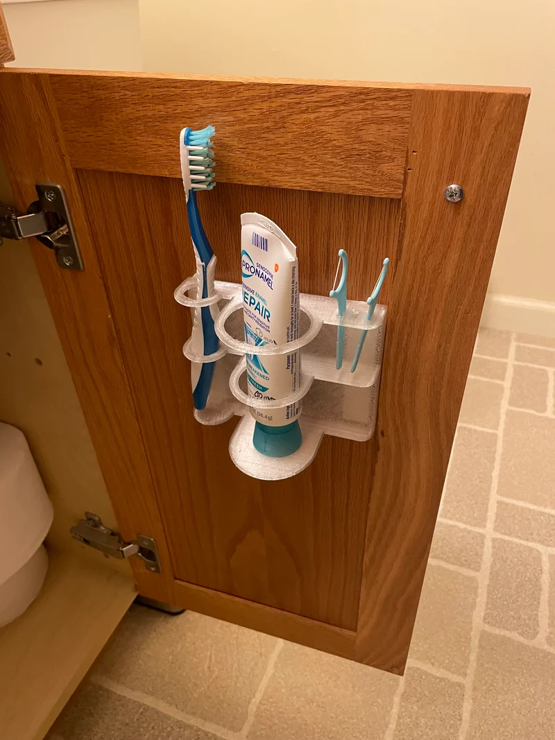 Porte-brosse à dents mural avec espace pour le dentifrice et le fil dentaire