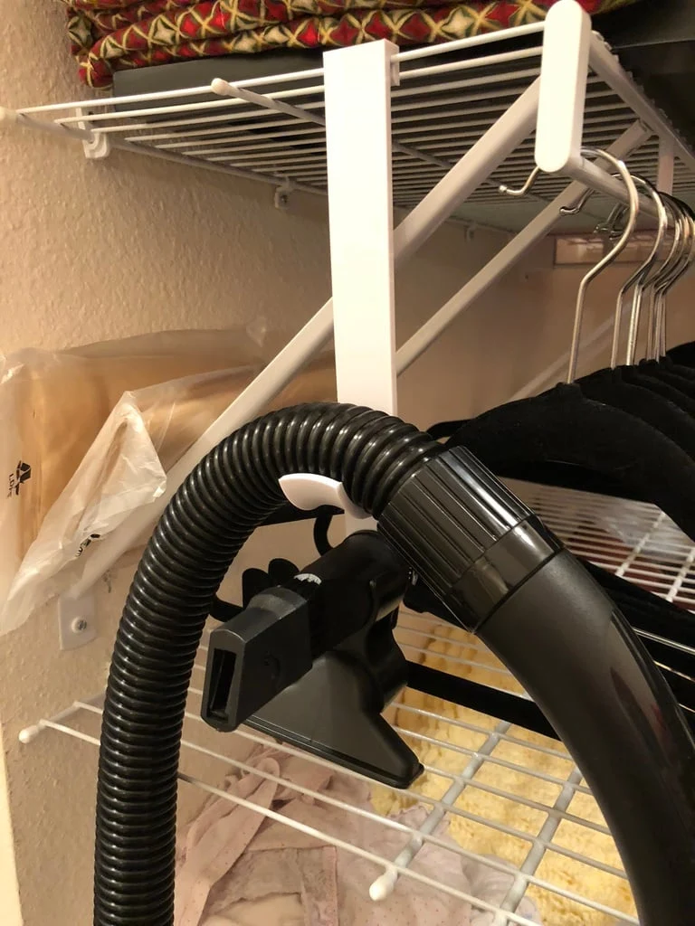 Support mural pour tuyau d'aspirateur standard