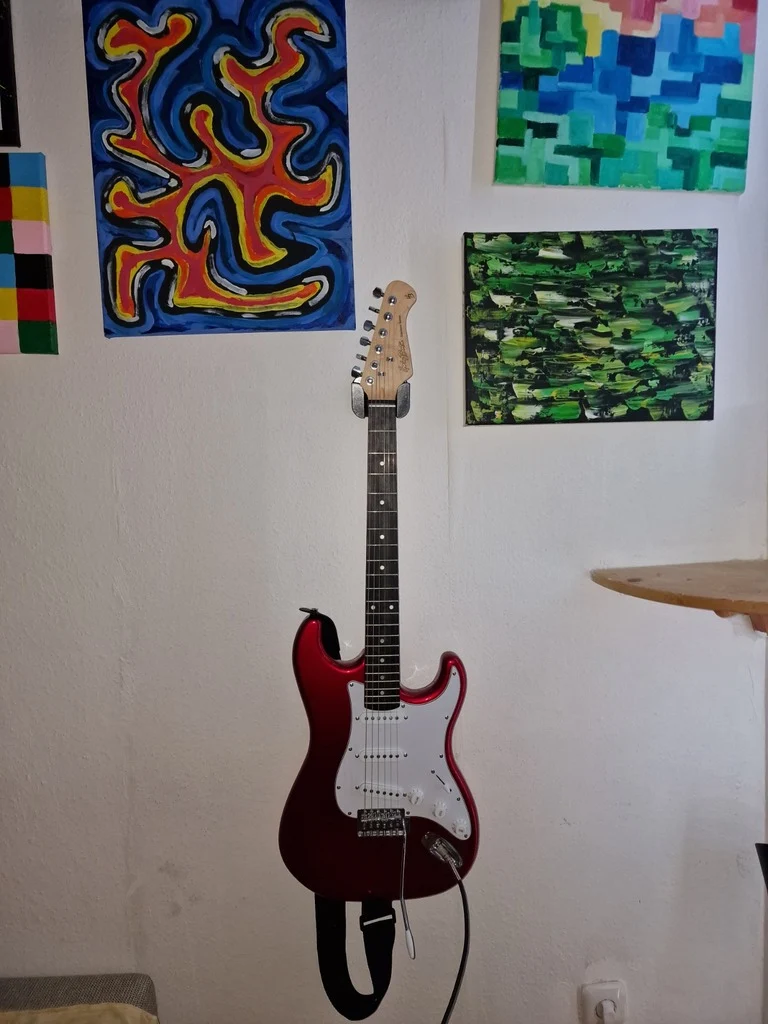 Support de guitare avec espace pour plectres